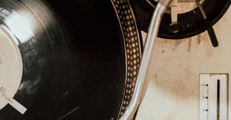 Laminate Vs. Vinyl - A record player with a record on it