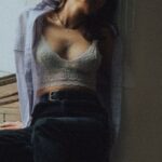 Hardwood Floors - Woman Sitting on Hardwood Floor Leaning on Doors with Eyes Closed