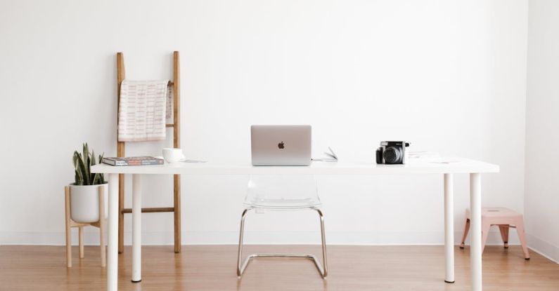 Hardwood Table - Silver MacBook on White Table
