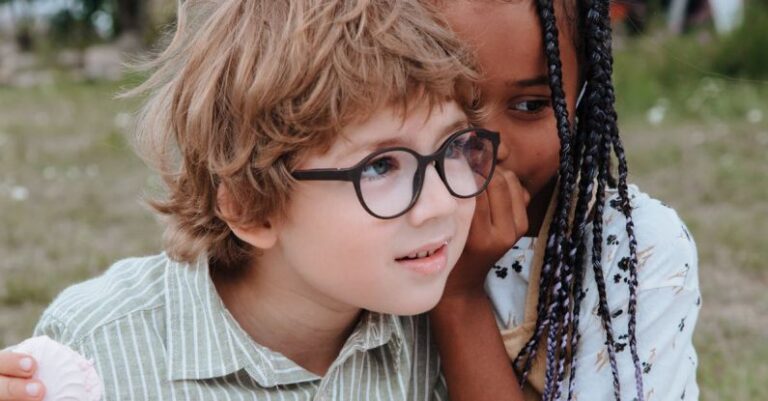 Garden Privacy - Girl Whispering to Boys Ear at Birthday Party in Garden