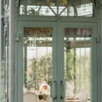 Sunroom - A Steel Framed Glass Structure with Table and Chairs