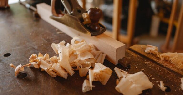 Decking Material - Jack plane and wooden plank on table