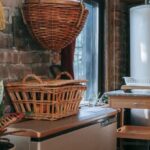 Appliance Storage - Interior of kitchen with brick wall decorated with wicker baskets